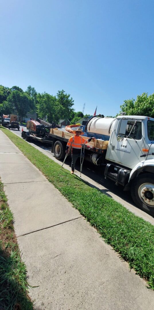 Construction worker with surveying equipment